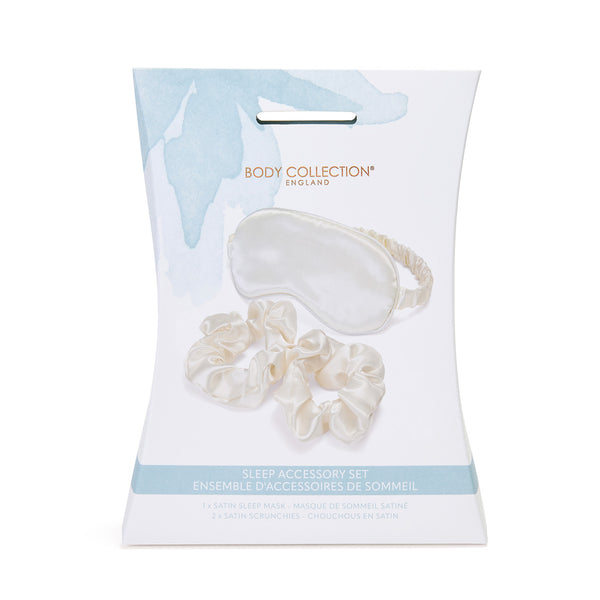 Sleep accessory set with eye mask and scrunchies in packaging on a white background